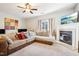 Relaxing living room featuring a fireplace and a sectional sofa at 207 Hampshire Downs Dr, Morrisville, NC 27560