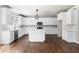 Modern kitchen with white cabinets, quartz countertops, and stainless steel appliances at 2112 Stanchion St, Haw River, NC 27258