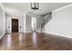 Large living room with hardwood floors, staircase, and high ceilings at 2112 Stanchion St, Haw River, NC 27258