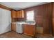 Simple kitchen with wood cabinets and linoleum flooring at 223 Knolls St, Chapel Hill, NC 27516