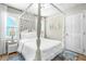 Bright bedroom with a four-poster bed and wood floors at , Raleigh, NC 27604