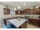 Modern kitchen with stainless steel appliances and a large island with seating at 235 Blair Hills Rd, Wendell, NC 27591