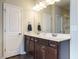 Double vanity bathroom with a large mirror and shower at 2489 Valley Dr, Clayton, NC 27520