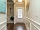 Bright entryway with hardwood floors and white door at 2489 Valley Dr, Clayton, NC 27520