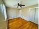Bright bedroom with hardwood floors and ceiling fan at 2923 Mckinney St, Burlington, NC 27217