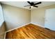 Bright bedroom with hardwood floors and ceiling fan at 2923 Mckinney St, Burlington, NC 27217