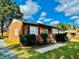 Side view of a brick ranch house with well-manicured landscaping at 2923 Mckinney St, Burlington, NC 27217