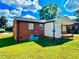 Rear view of house with a covered patio and a large yard at 2923 Mckinney St, Burlington, NC 27217