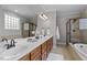 Double vanity bathroom with soaking tub and walk-in shower at 300 Duchart Ln, Fuquay Varina, NC 27526