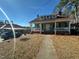 Green house with front porch and yard at 302 N 12Th St, Erwin, NC 28339