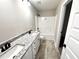 Bathroom with double vanity and granite countertop at 305 E Pope Ave, Kenly, NC 27542