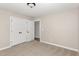 Spacious bedroom with double doors leading to hallway at 305 E Pope Ave, Kenly, NC 27542