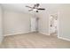 Bright bedroom with carpet, ceiling fan and en-suite bathroom at 307 E Pope Ave, Kenly, NC 27542