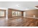 Spacious unfinished basement with hardwood floors and large windows at 312 Trinity Creek Dr, Holly Springs, NC 27540