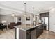 Island kitchen with granite countertops and stainless steel appliances at 312 Trinity Creek Dr, Holly Springs, NC 27540