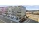 Gray three-story townhouses with private balconies and attached garages at 414 Gaston Park Ln # 100, Wake Forest, NC 27587