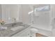 Clean bathroom with a shower/tub combo and granite vanity at 407 Sixth St, Wake Forest, NC 27587