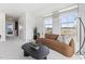 Spacious living area featuring a comfortable couch and large windows at 410 Gaston Park Ln # 100, Wake Forest, NC 27587