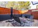 Cozy patio with modern furniture and wooden privacy walls at 4105 Glen Laurel Dr, Raleigh, NC 27612