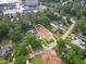 Aerial view of a vacant lot surrounded by mature trees and neighboring homes at 4112 Rockingham Dr, Raleigh, NC 27609