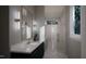 Spa-like bathroom with marble flooring and walk-in shower at 4112 Rockingham Dr, Raleigh, NC 27609