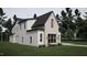 Two-story house with white siding and a dark roof at 4112 Rockingham Dr, Raleigh, NC 27609