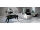 Game room with foosball table, sectional sofa, and pool table at 4112 Rockingham Dr, Raleigh, NC 27609