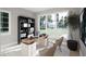 Home office with built-in shelving and large windows at 4112 Rockingham Dr, Raleigh, NC 27609