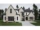 Elegant two-story home with stone and siding exterior at 4112 Rockingham Dr, Raleigh, NC 27609
