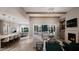 Open living space with fireplace and access to outdoor patio at 4112 Rockingham Dr, Raleigh, NC 27609