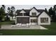 Home exterior featuring backyard pool and stone patio at 4112 Rockingham Dr, Raleigh, NC 27609