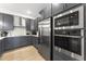 Sleek kitchen with stainless steel appliances and gray cabinetry at 412 Gaston Park Ln # 100, Wake Forest, NC 27587