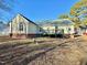 House back view with deck and spacious backyard at 414 Ash Lily Ct, Nashville, NC 27856