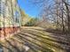 House backyard with large grassy area and trees at 414 Ash Lily Ct, Nashville, NC 27856