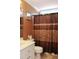 Clean bathroom with shower/tub combo and white vanity at 414 Ash Lily Ct, Nashville, NC 27856