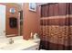 Small bathroom with shower and zebra print curtain at 414 Ash Lily Ct, Nashville, NC 27856