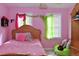 Pink bedroom with double bed and two windows at 414 Ash Lily Ct, Nashville, NC 27856