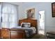 Spacious bedroom with wood bed frame and en-suite bathroom at 414 Ash Lily Ct, Nashville, NC 27856
