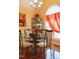 Bright dining area with glass table and four chairs at 414 Ash Lily Ct, Nashville, NC 27856