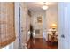 Bright and airy entryway with hardwood floors, a chandelier and a view into the living room at 414 Ash Lily Ct, Nashville, NC 27856