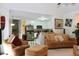 Open concept living room with a view into the kitchen and access to the dining area at 414 Ash Lily Ct, Nashville, NC 27856
