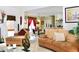 Open concept living room with kitchen views, featuring comfortable seating and a neutral color palette at 414 Ash Lily Ct, Nashville, NC 27856