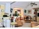 Open-concept area with tan sofas and kitchen wet bar at 414 Ash Lily Ct, Nashville, NC 27856