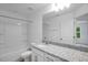 A full bathroom with granite countertop vanity, shower/tub combo and white fixtures at 433 Rowe Way, Knightdale, NC 27545
