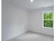 A well-lit room with a window view of lush green trees offering a serene and peaceful atmosphere at 433 Rowe Way, Knightdale, NC 27545