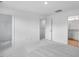 Bright bedroom with neutral carpet, doors to ensuite, and walk-in closet at 433 Rowe Way, Knightdale, NC 27545