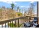 Comfortable deck with seating overlooks a wooded area, perfect for relaxing and enjoying nature at 433 Rowe Way, Knightdale, NC 27545