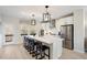 Bright kitchen featuring a large center island with bar seating and stainless steel appliances at 433 Rowe Way, Knightdale, NC 27545