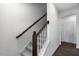 Interior view of the staircase, railing, and modern design at 433 Rowe Way, Knightdale, NC 27545