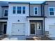 New construction townhome with gray siding and white trim at 5002 Cambrey Dr # 2, Durham, NC 27703